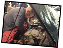 Mechanic at Work - Richman Automotive & Towing image 2